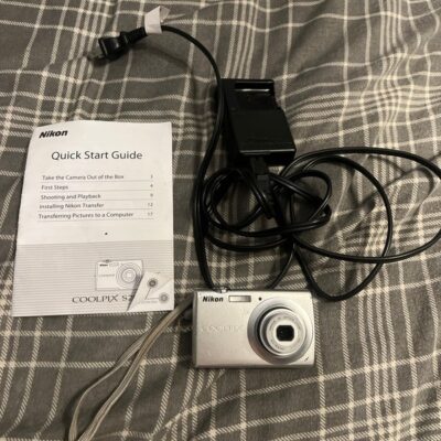Nikon CoolPix S203 Digital Camera With Battery & Charger & Guide